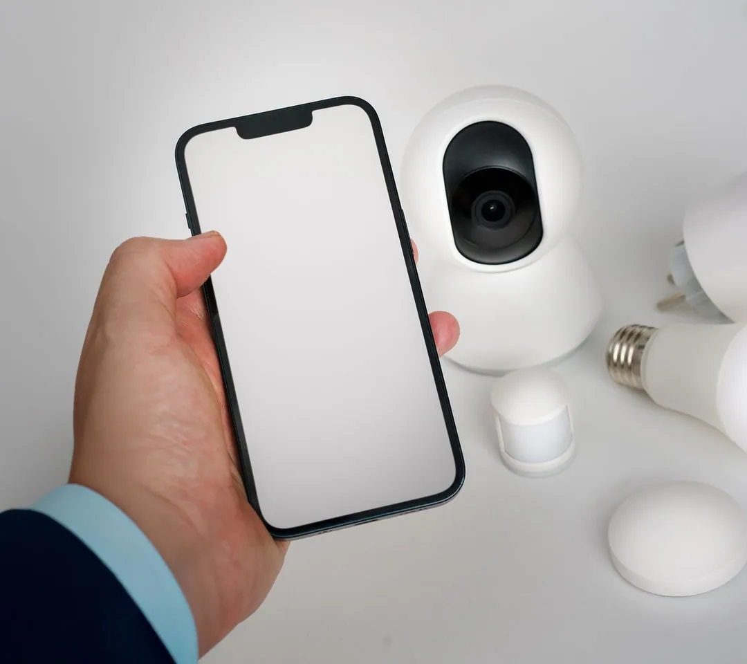 Phone controlling a smart home security camera, lights and sensors